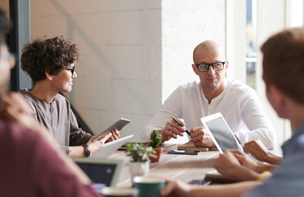 a group of people sitting around a table